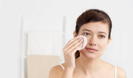 Bioderma - woman cleansing her face
